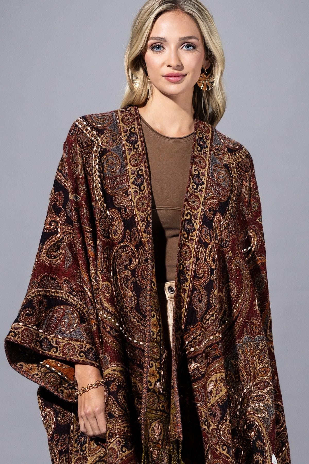 Close-up of the soft-touch wool fabric and dramatic fringe on this Whimsigoth paisley shawl