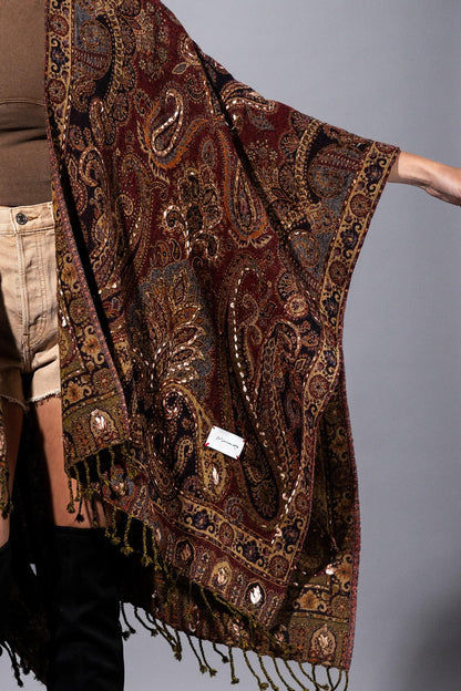 Side angle of a silk and lace paisley ruana featuring an editorial-level drape and fluid movement