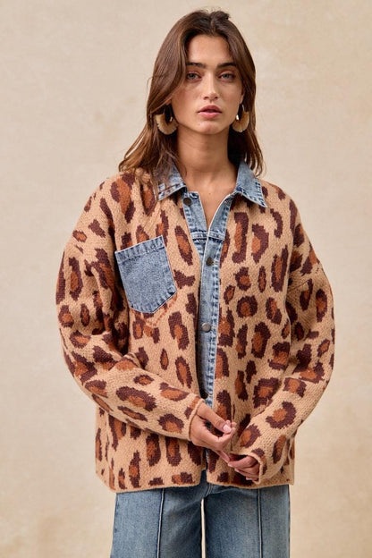 Close-up view of the button-down front on this streetwear-inspired animal print outerwear garment.