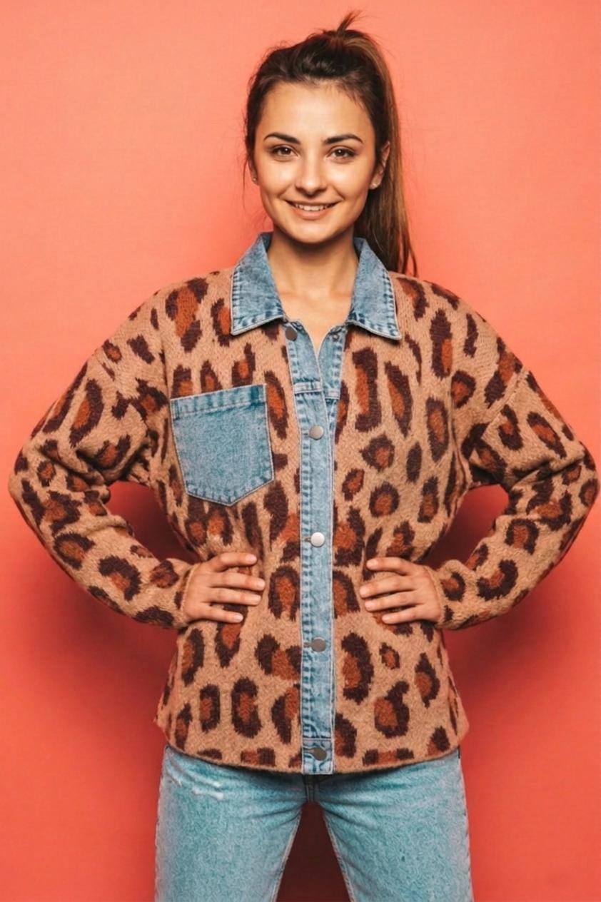 Close-up of the premium soft-touch leopard print knit fabric and structured denim button placket.
