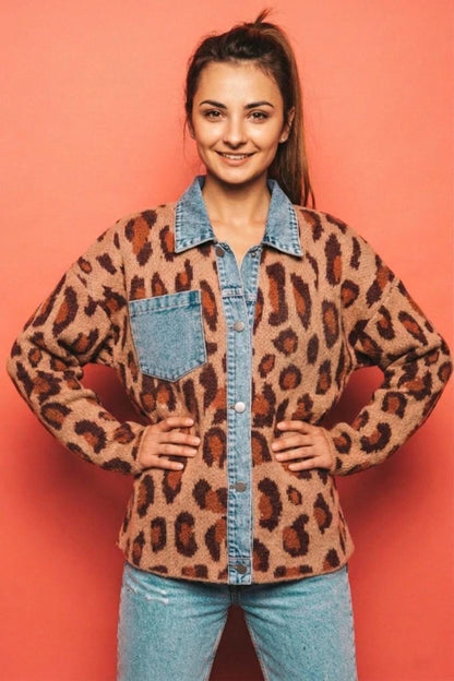Close-up of the premium soft-touch leopard print knit fabric and structured denim button placket.