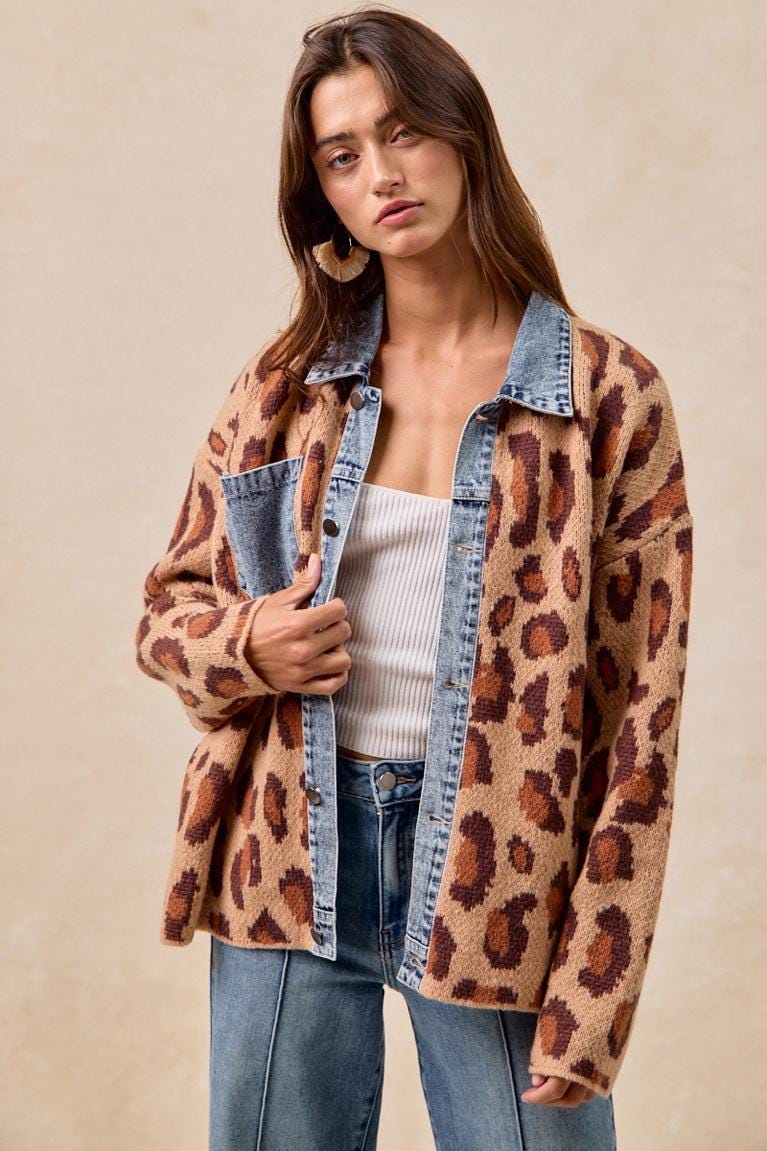 Model wearing the indie sleaze leopard shacket with light wash jeans for a 90s grunge aesthetic.