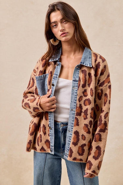 Model wearing the indie sleaze leopard shacket with light wash jeans for a 90s grunge aesthetic.