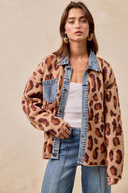 Profile view of the mid-weight leopard print outerwear piece with its intentional loose-fit drape.
