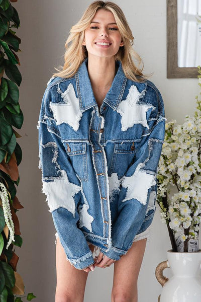 Front view of a medium wash blue star denim jacket with distressed patchwork and raw edge fringe details.