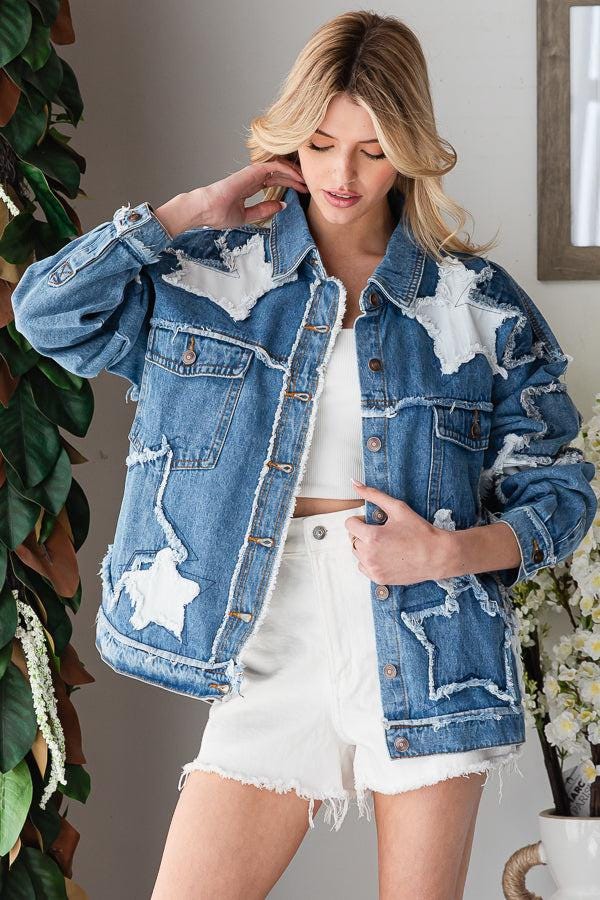 Detailed view of the collar and shoulders on a Y2K style patchwork denim jacket with celestial star accents.