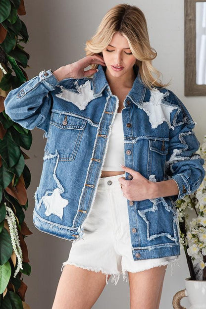 Detailed view of the collar and shoulders on a Y2K style patchwork denim jacket with celestial star accents.