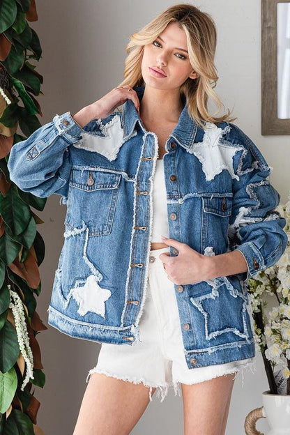 Distressed hem and cuff details of a 100% cotton blue denim jacket with artistic three-dimensional textures.