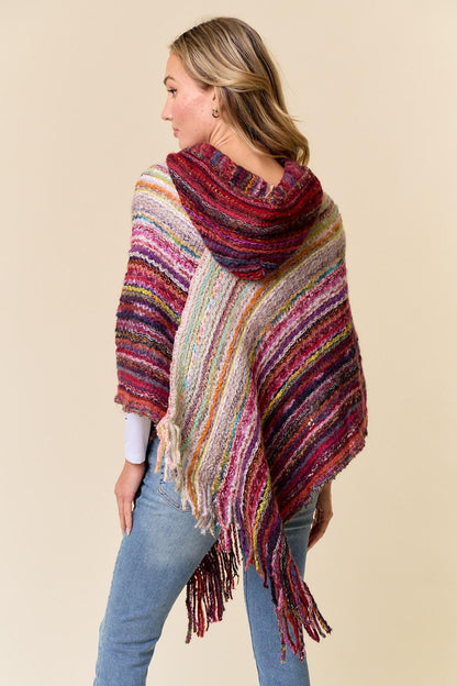 Flat lay of the lightweight acrylic striped hooded shawl showing the full rectangular shape
