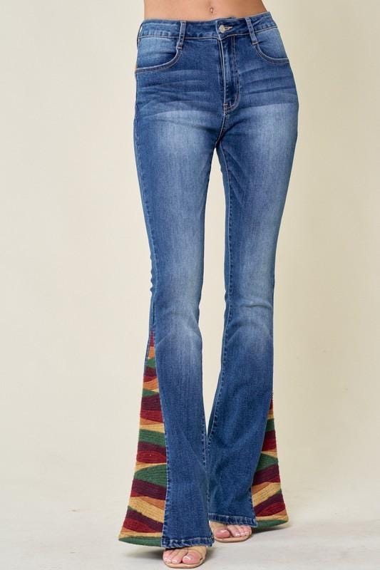 Detail of durable cotton-blend denim and precision stitching on high-waisted boho flare jeans