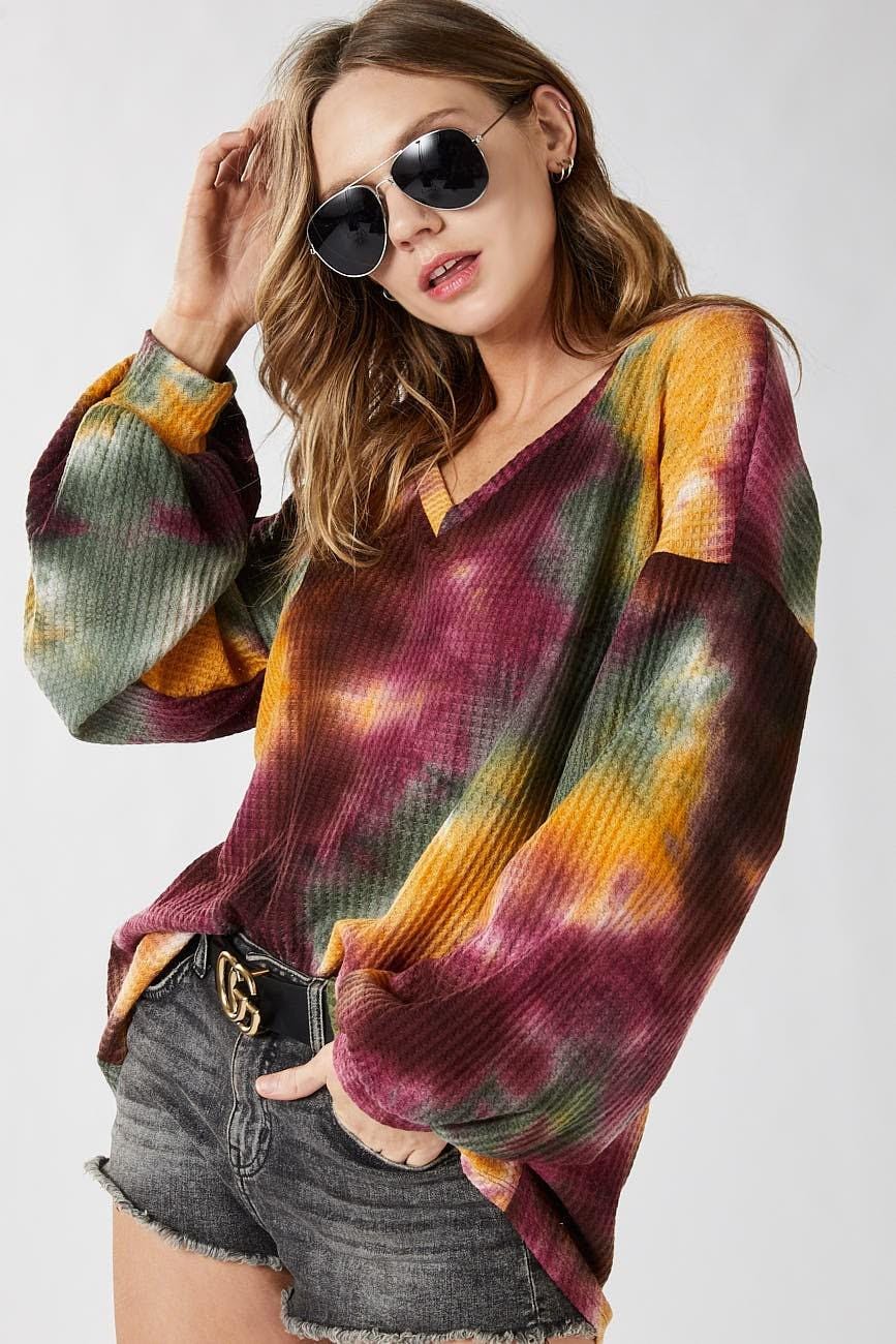 Full outfit styling of the fall fashion tie dye top featuring a vibrant mustard and maroon wash.
