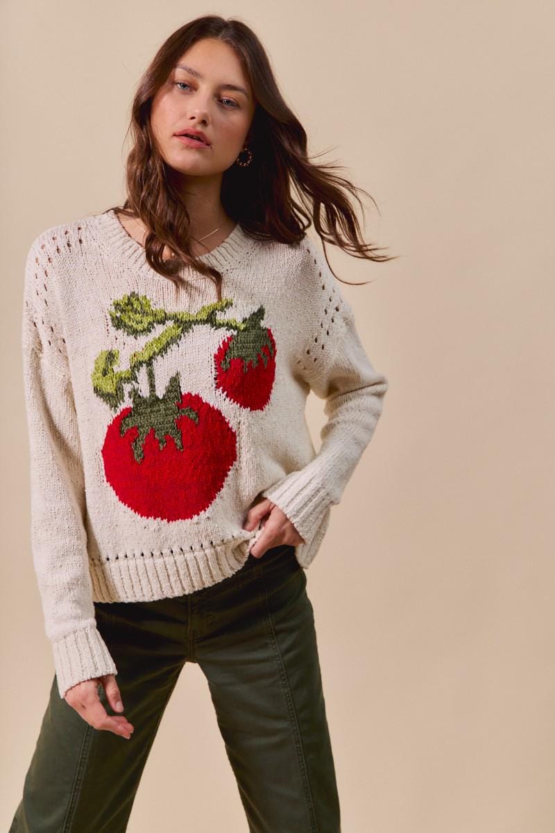 Side view of the oversized vintage-inspired pullover showcasing the airy cotton blend fabric