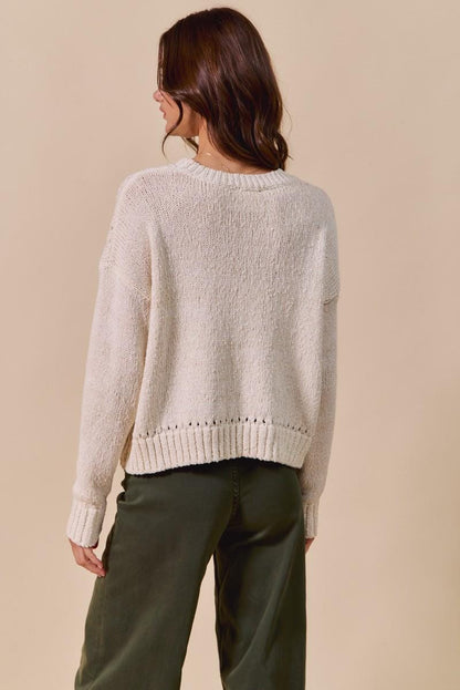 Flat lay of the boho-chic tomato graphic sweater showing the full design and whimsical aesthetic