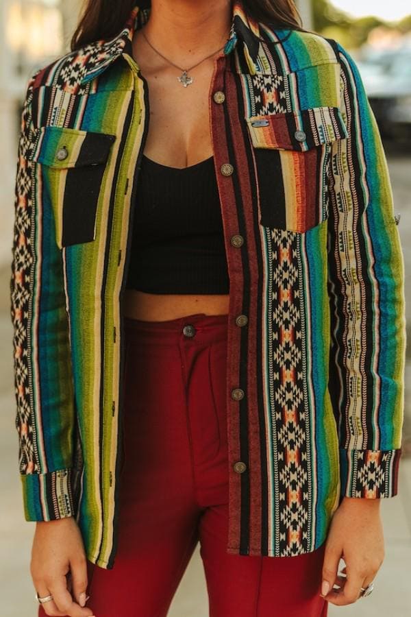 Back view of the polyester roll-tab southwestern shirt showcasing a relaxed silhouette and geometric patterns