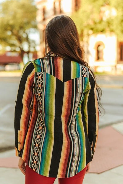 Close-up of the intricate tribal jacquard fabric and functional chest pockets on this boho-chic rodeo shirt