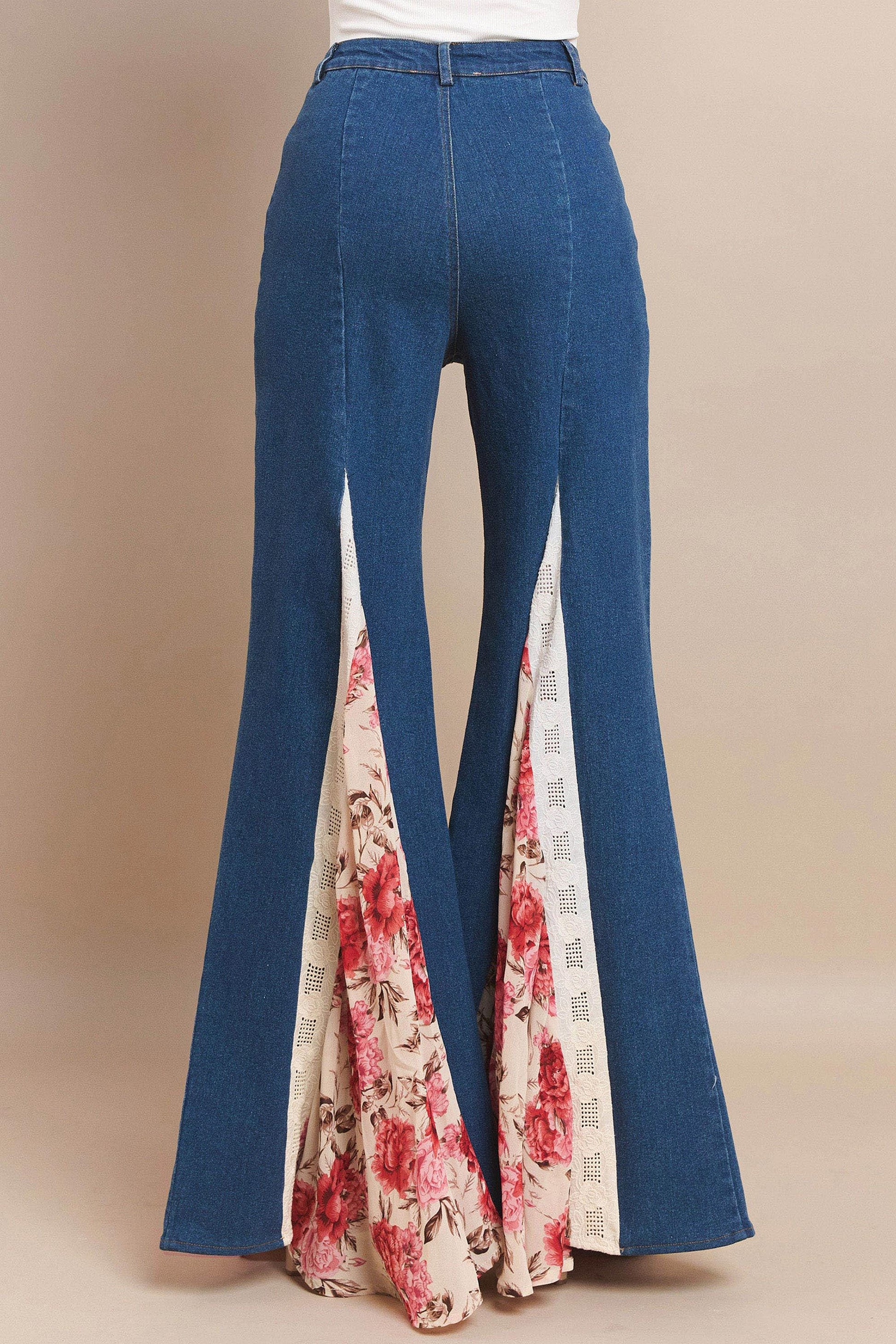 Side profile of wide leg jeans with sweeping flared legs and intricate cottagecore floral details