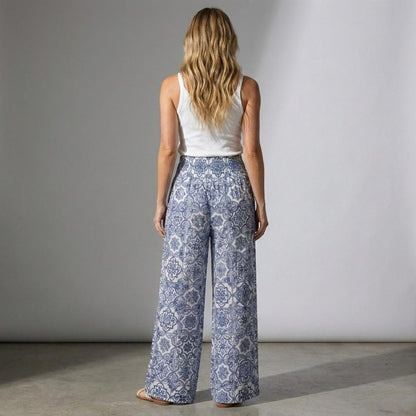 Side profile of tall blue and white trousers showing the long 34-inch inseam and breezy drape