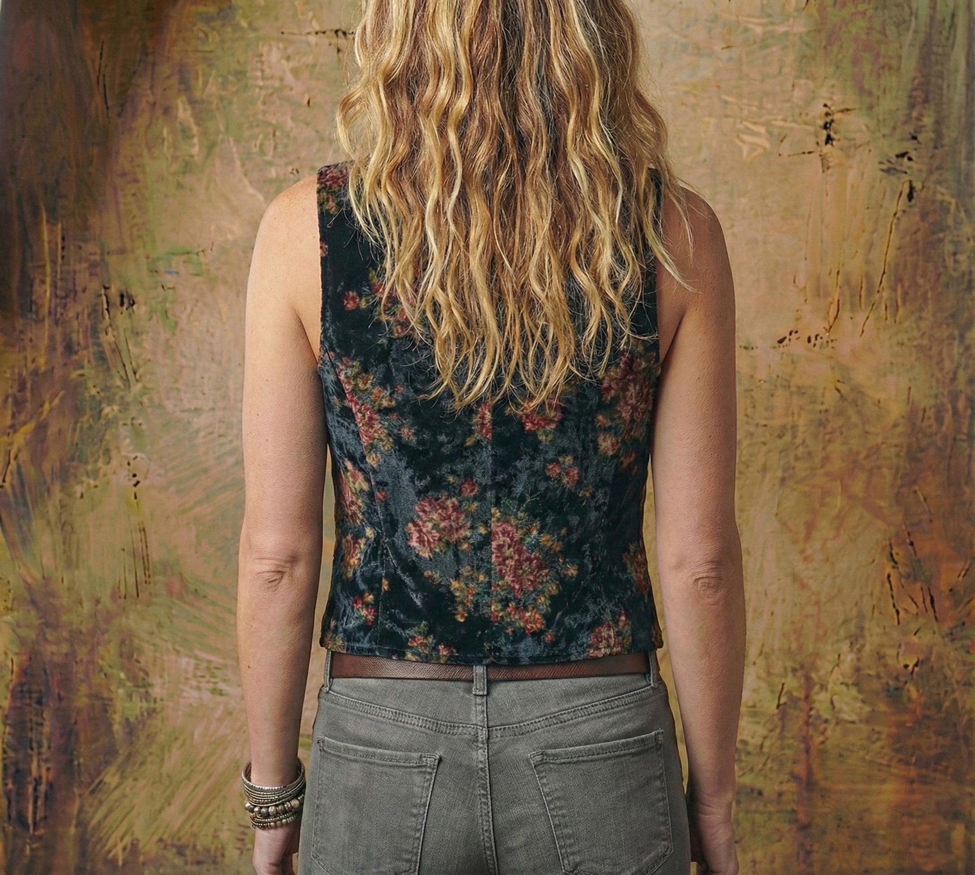 Model wearing the vintage style floral vest in a romantic goth outfit with bohemian layering