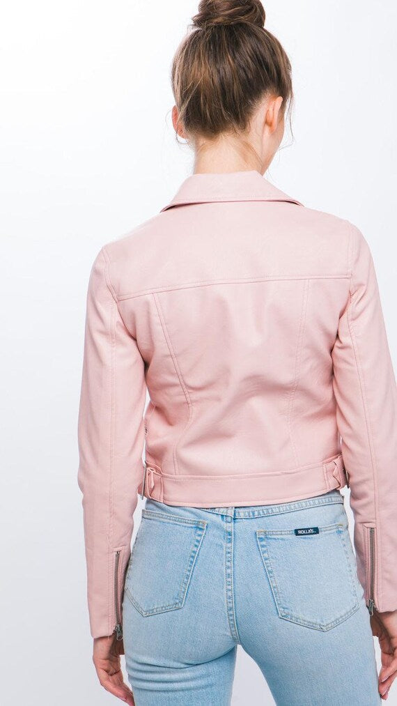 Back view of women's edgy pink moto jacket with adjustable side straps