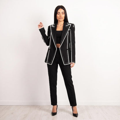 Back view of avant-garde black blazer with sharp princess seams