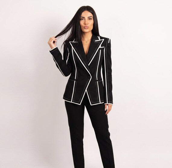 Detail of peaked lapel on tailored 'Old Money' style black blazer