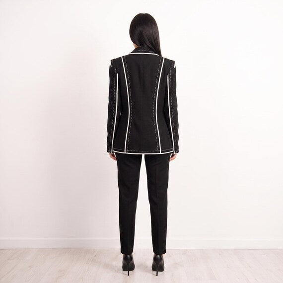 Front detail of structured black blazer, accentuating designer fit