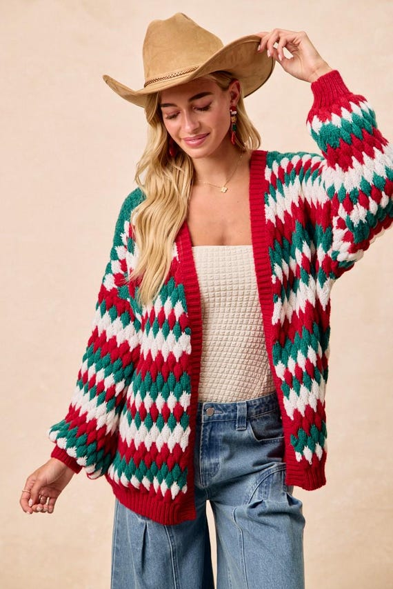 Detail of the balloon sleeves on a cozy cottagecore chunky knit Christmas sweater