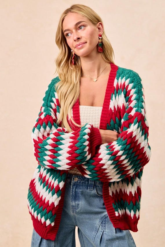 Flat lay of the polyester chunky knit holiday sweater, showcasing its soft texture and Christmas pattern