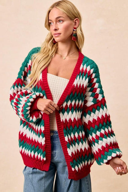 Close-up of the neckline and button-up front of a diamond pattern winter cardigan