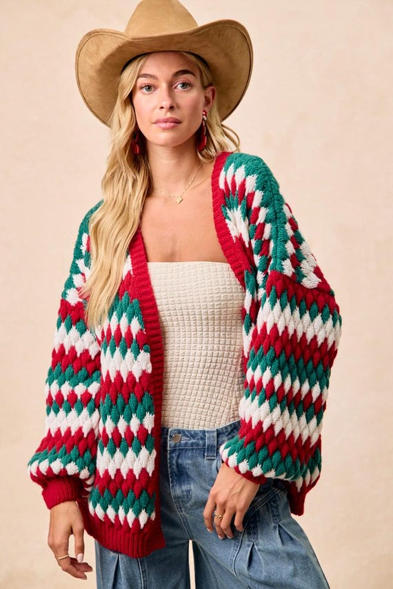 A woman wearing the oversized cottagecore cardigan outdoors for a cozy, festive Christmas look