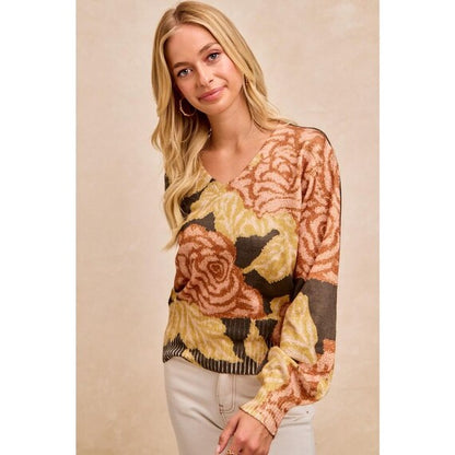 Blonde woman wearing a Whimsigoth dark floral knit sweater with balloon sleeves and a V-neck in olive and peach.