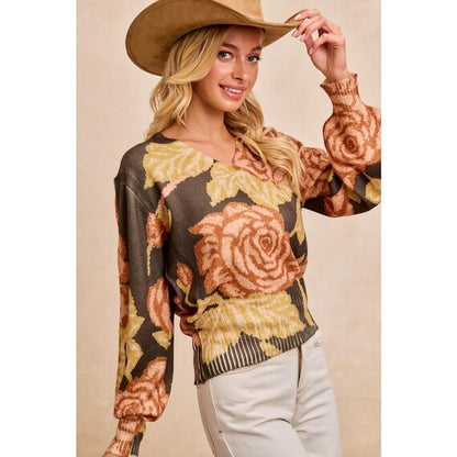 Detail of the dramatic balloon sleeves on the boho olive green jumper