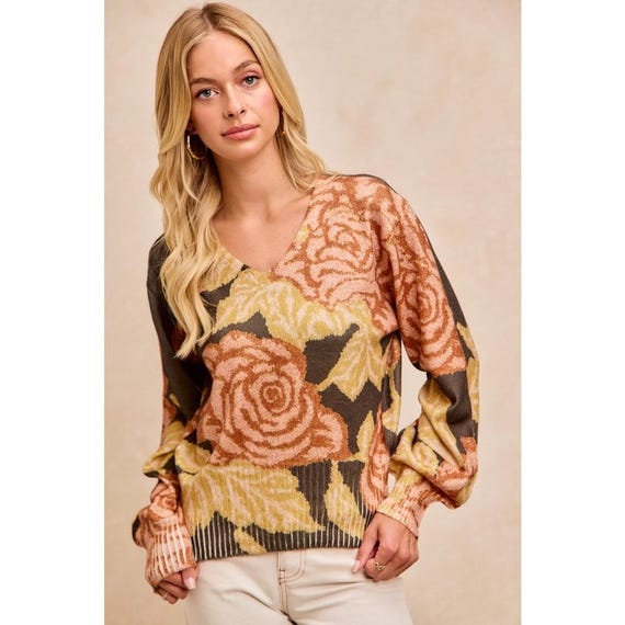 Model styled in a Whimsigoth dark olive sweater with large flower print for a boho fall look