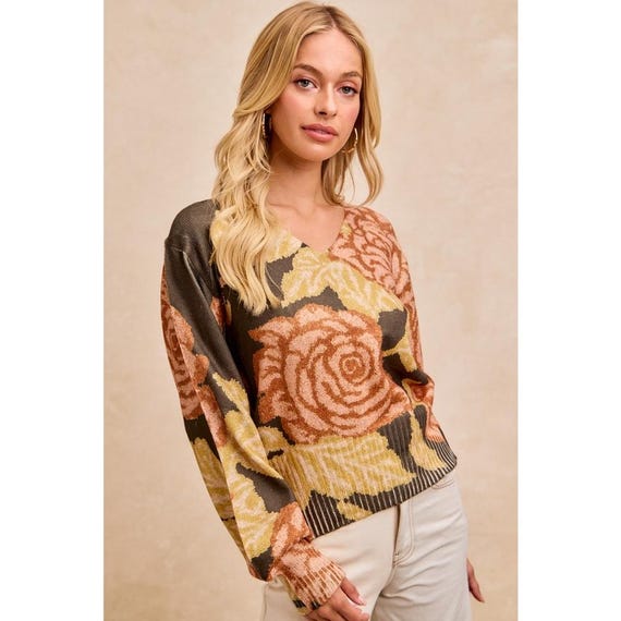 Side profile of the V neck pullover showing the relaxed, flattering fit on a tall frame