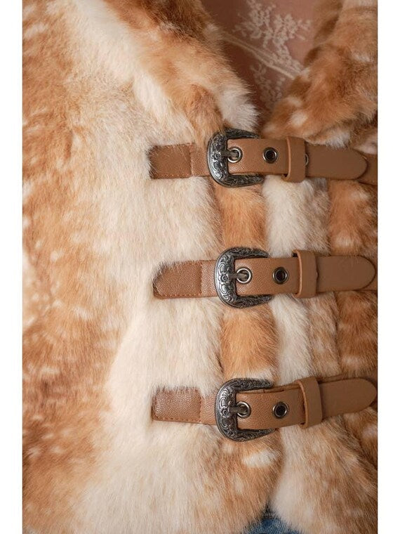 Detail of western-style buckle closure on a deer print faux fur coat
