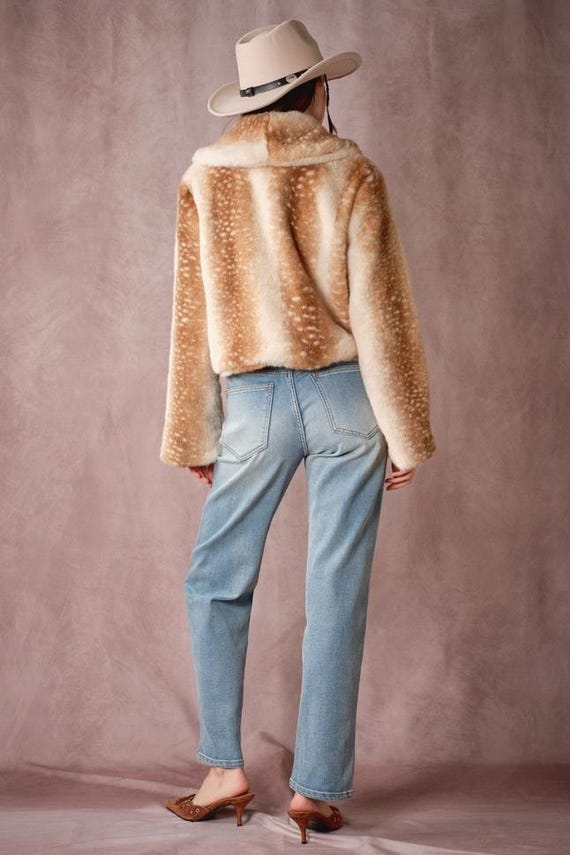 Women's western style faux fur jacket in deer print, showcasing cozy warmth