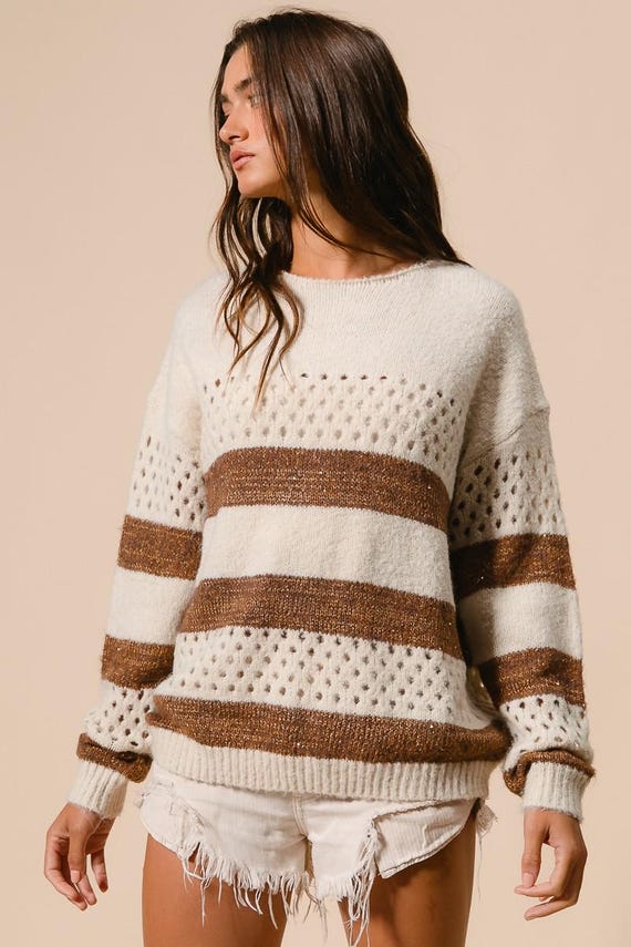 Women's cream and brown striped perforated knit sweater in a relaxed fit boho casual style.