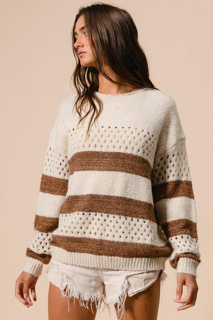 Women's cream and brown striped perforated knit sweater in a relaxed fit boho casual style.
