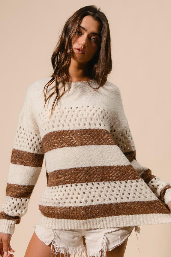 Women's cream and brown striped perforated knit sweater, relaxed fit, long sleeve, crewneck, boho casual style.
