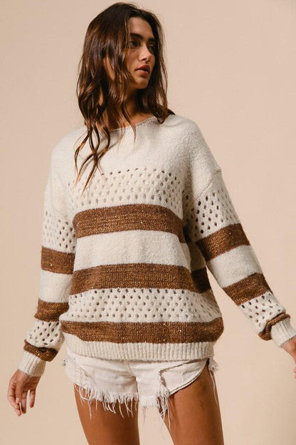 Women's relaxed boho casual knit sweater featuring cream and brown horizontal stripes with perforated details.