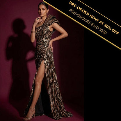 One-shoulder sequin mermaid gown in bronze zebra print featuring a structured shoulder and high thigh slit.