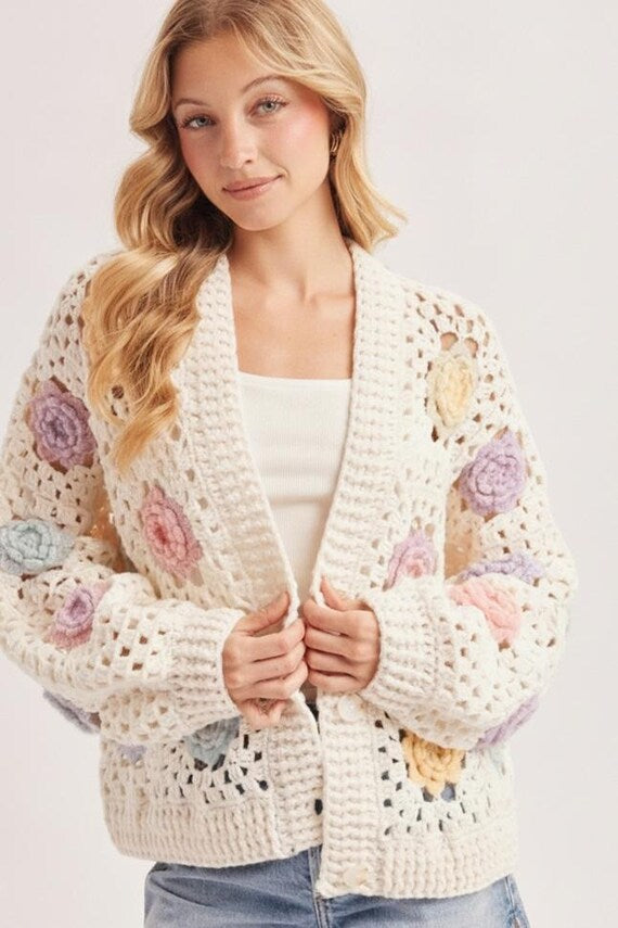 Medium weight, breathable open stitch crochet cardigan with handmade 3D floral details