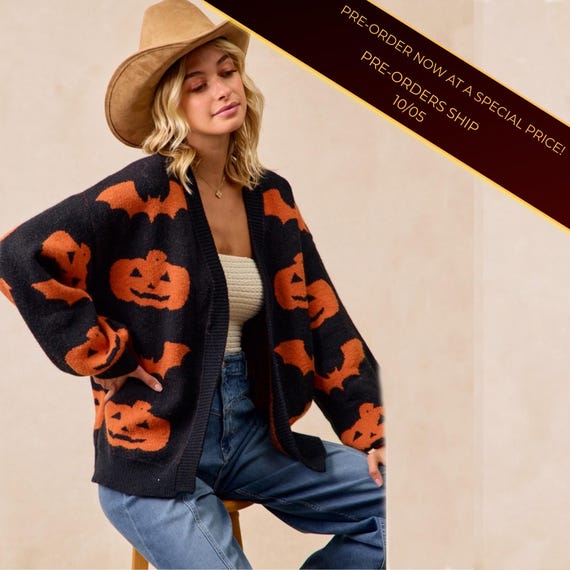Front view of Women's Whimsigoth Pumpkin Bat Print Cardigan, cozy acrylic polyester blend, open-front style.