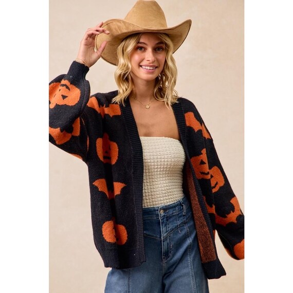 Cozy Autumn Whimsigoth Sweater, a relaxed fit orange black jacket with playful pumpkin and bat details.