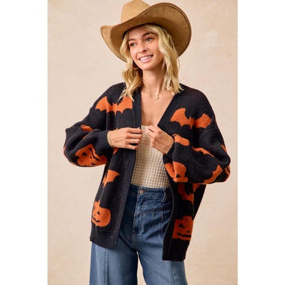 Women's black and orange pumpkin bat print open-front Whimsigoth knit cardigan with a cozy, slouchy fit.