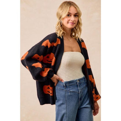 Model wearing an oversized Pumpkin Bat Print Cardigan, a cozy autumn jacket with long sleeves for chilly days.