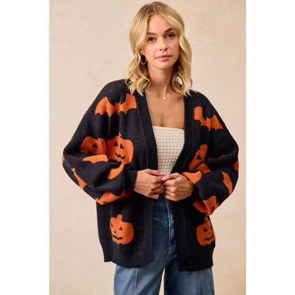 Side view of the orange and black Open Front Cardigan, featuring a slouchy knit and drop shoulder design.