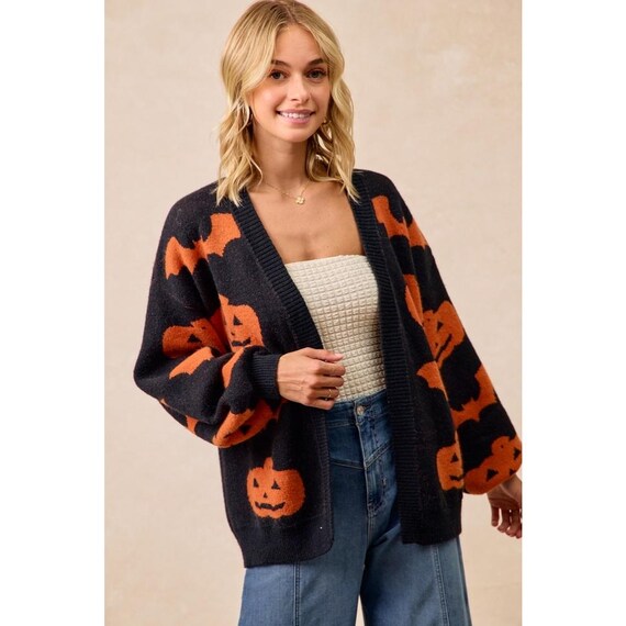 Soft acrylic polyester blend fabric detail of the Women's Pumpkin Bat Print Cardigan, ensuring warmth without bulk.