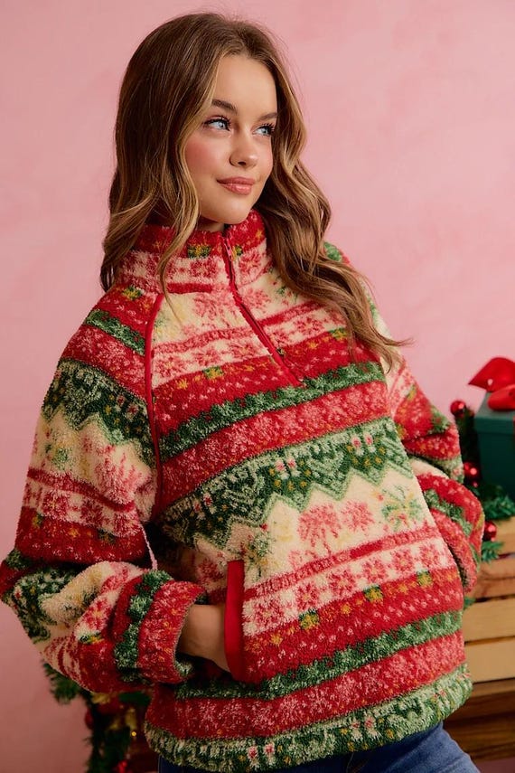 Women's cozy Fair Isle sherpa quarter-zip pullover in red, green, and cream with a high mock collar.