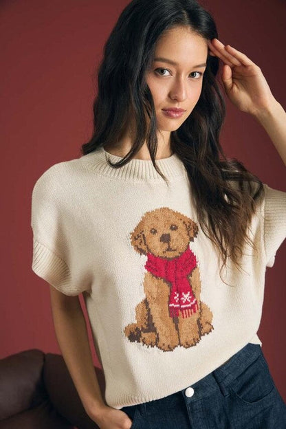 Close-up of the textured knit fabric and intarsia puppy graphic on sweater